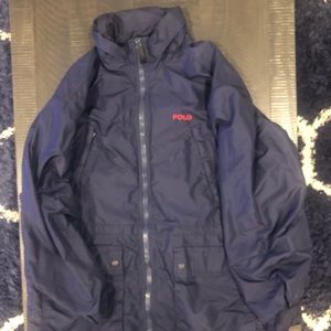 Polo windbreaker jacket with hood.